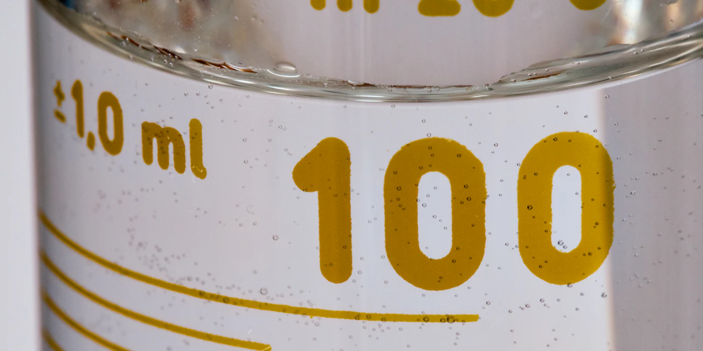 Measuring cylinder with volume markings